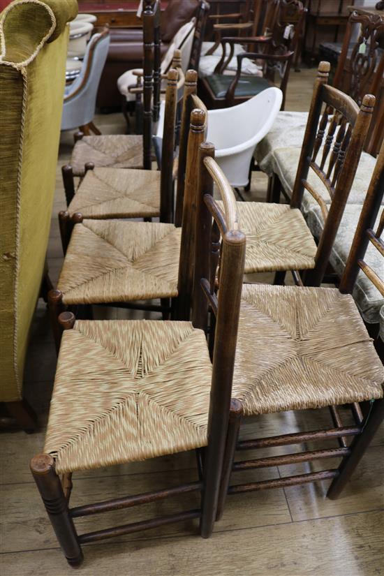 Five rush seat chairs and another